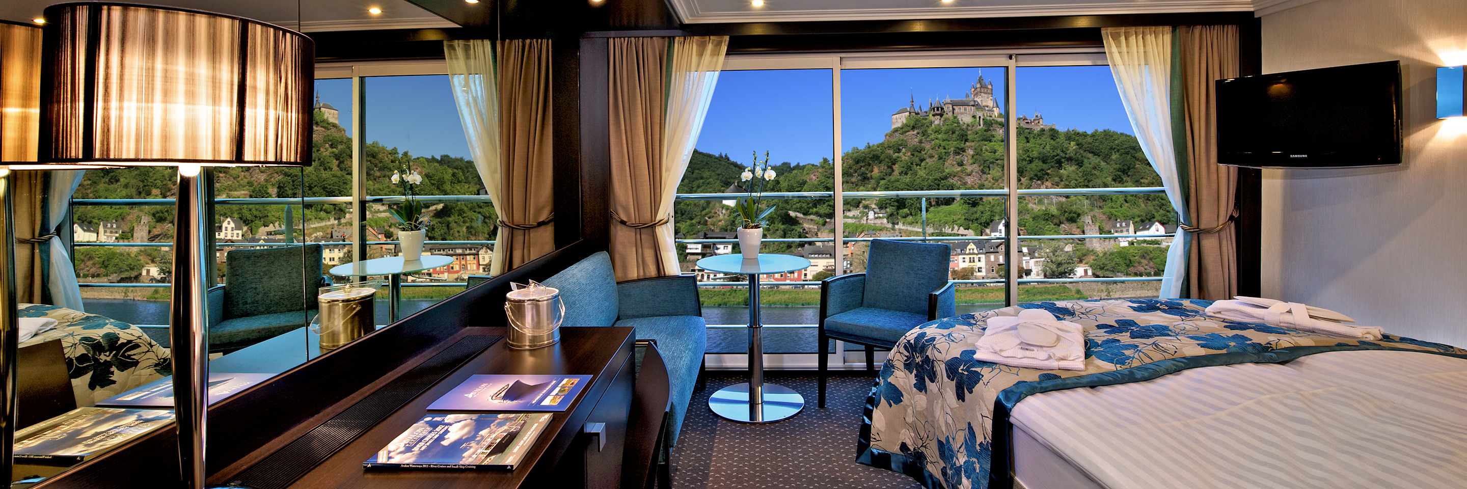 Avalon Panorama Suite with floor-to-ceiling windows facing the river